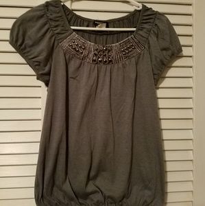 Grey blouse with accented neckline